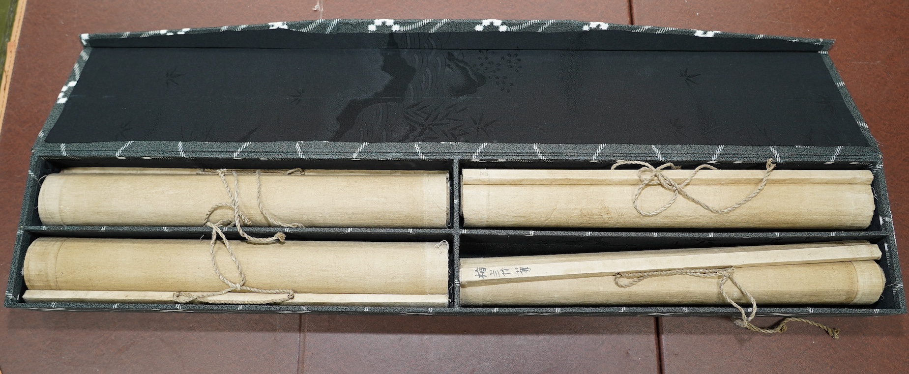 Chinese School, a set of four scroll paintings on paper of plum, orchid, bamboo and chrysanthemum, boxed. Condition - fair to good